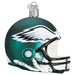 The Philadelphia Eagles Helmet 72517 Old World Christmas Ornament is a hand-painted glass ornament that captures the essence of the Philadelphia Eagles. It showcases a green and white football helmet design adorned with a wing emblem on the side and includes a silver loop for easy hanging.