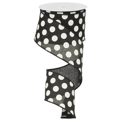 A spool of 2.5 Medium Multi Dot Black White Ribbon (RX9146X6), featuring black fabric with medium white dots, is partially unrolled and hanging in a spiral shape.