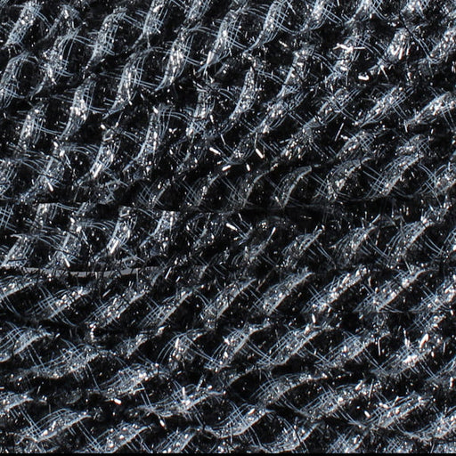 A close-up of the Tinsel Flex Tubing Black Silver RE3542E1 reveals a grid-like design with interwoven threads. The material resembles metallic tinsel, blending shiny and matte fibers for a textured appearance with a slight sheen.