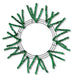 The 24 Pencil Work Wreath Metallic Emerald Green (XX751106) features sparse green artificial pine branches and metallic emerald green mesh on a circular wire base, elegantly set against a white background.